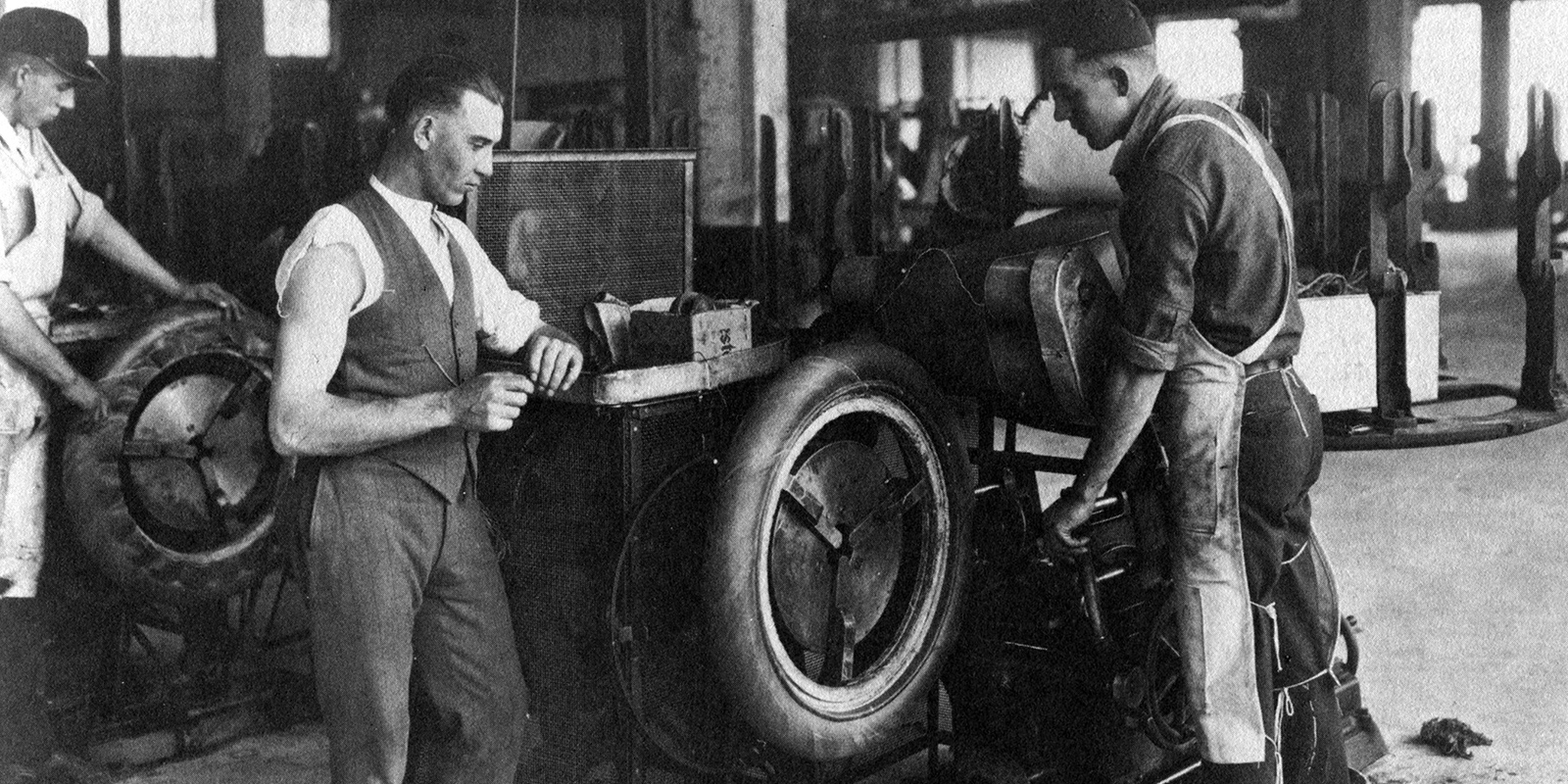 Firestone workers with tire